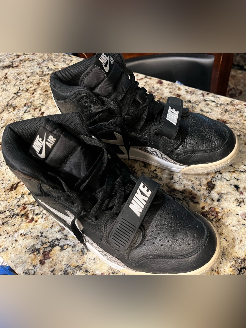 Nike Air Jordan Black and White Mid-Top Sneakers